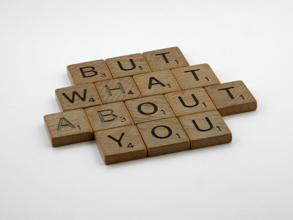 four scrabble tiles spelling out the words but what about you?