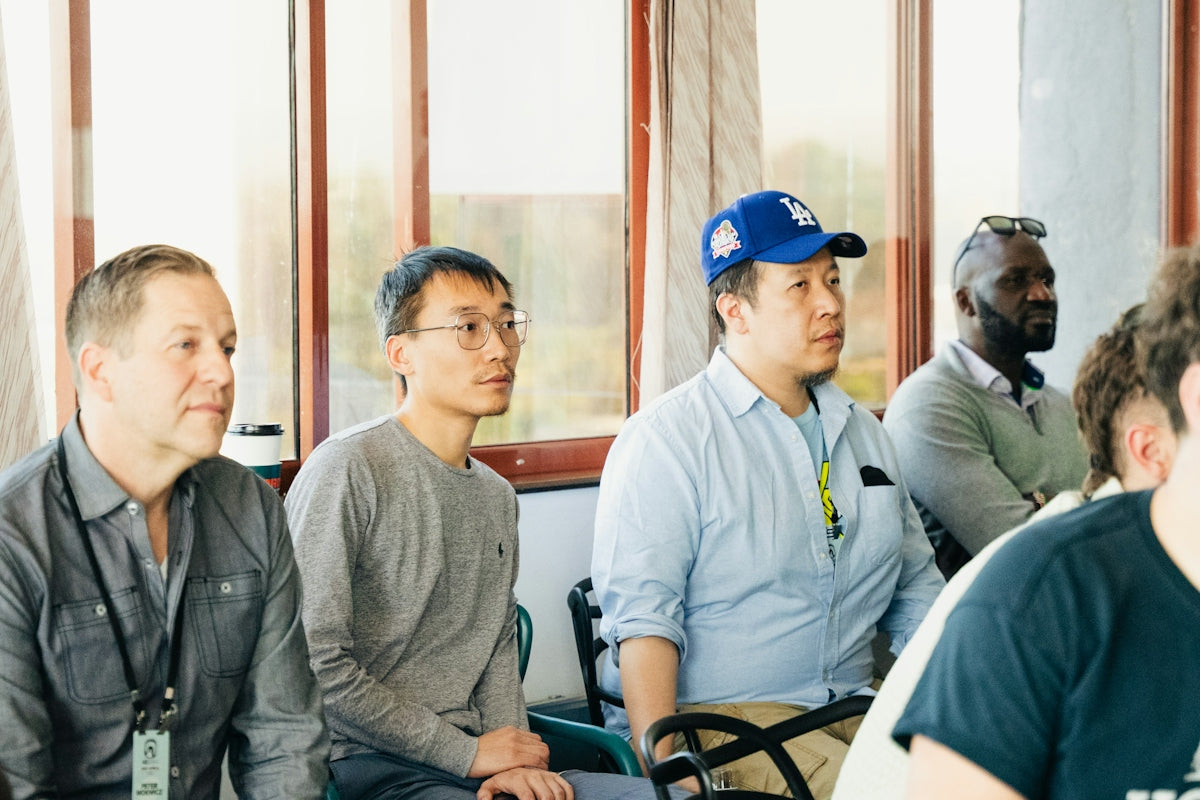 Diverse group of men attentively listening